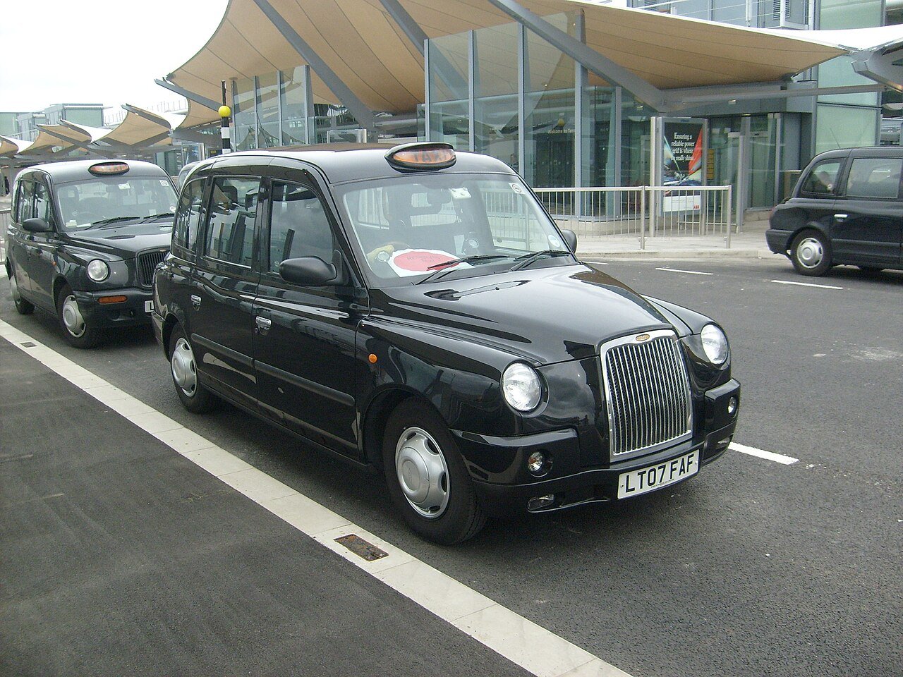 Black London taxi at Heathrow Airport Terminal 5